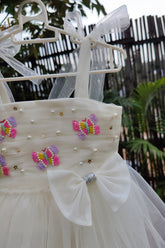 White draped dress with butterflies